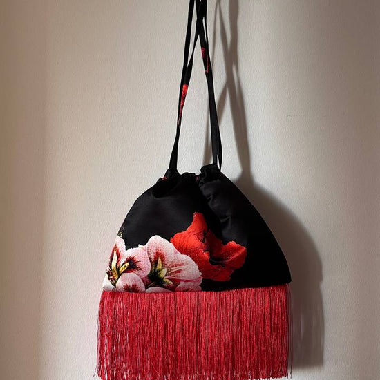 Black pouch with red fringe