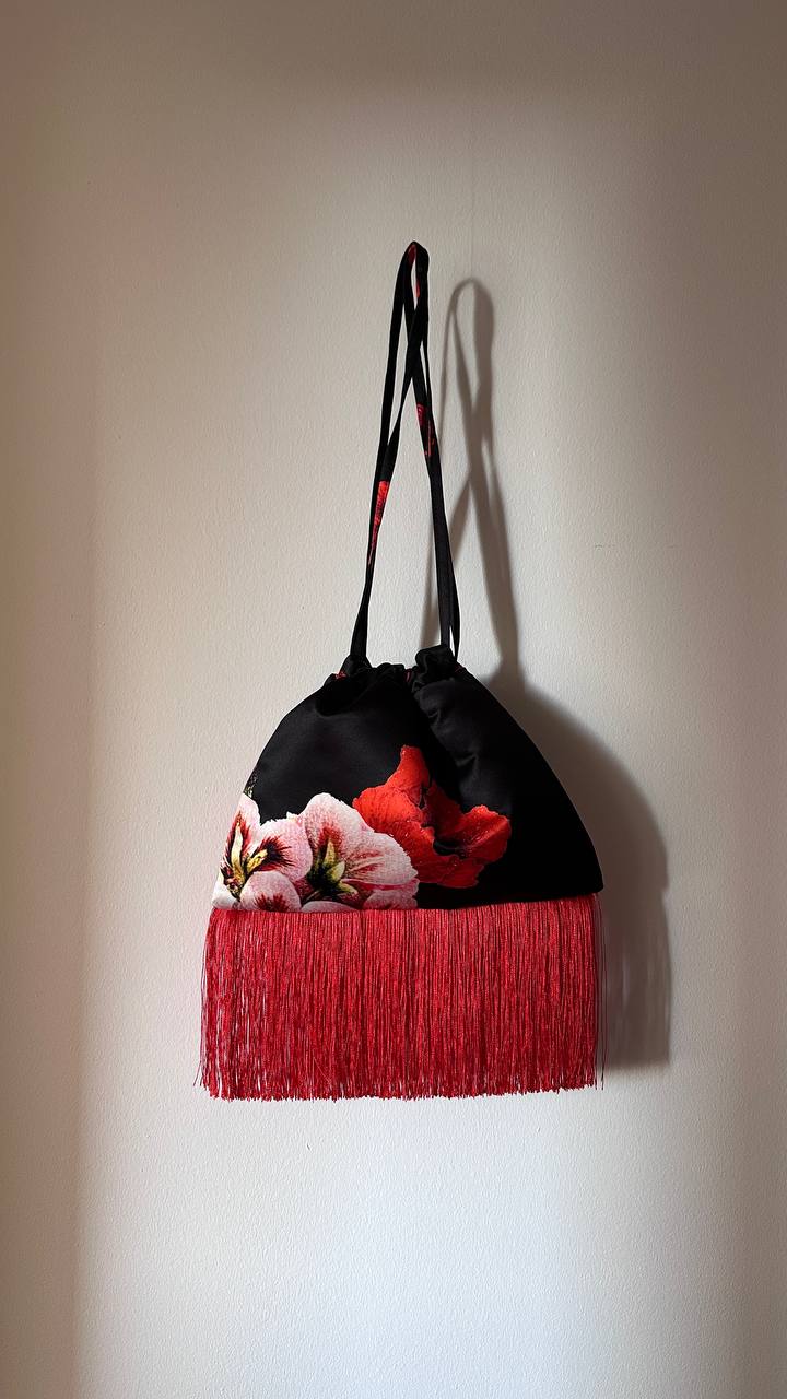 Black pouch with red fringe